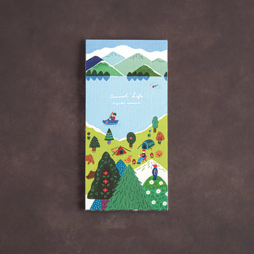 A rectangular note pad titled 'Animal Life' featuring a colorful hand-drawn landscape with mountains, lakes, trees, tents, and small figures, displayed on a dark brown textured background.