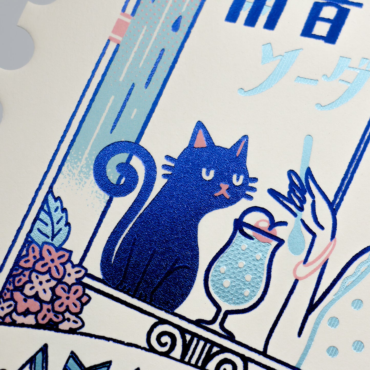 Illustration of a blue cat with a glass of soda on a decorative postcard with Japanese text.