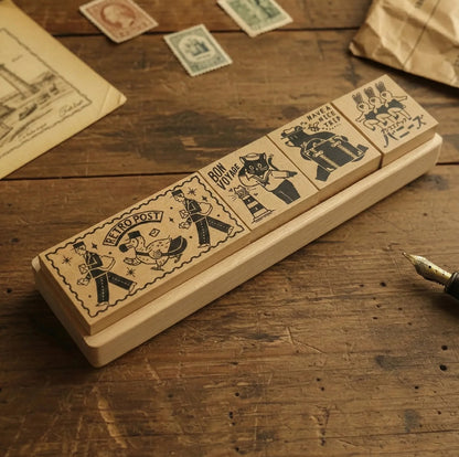 Set of vintage-style rubber stamps on a wooden surface with stamps and paper in the background.