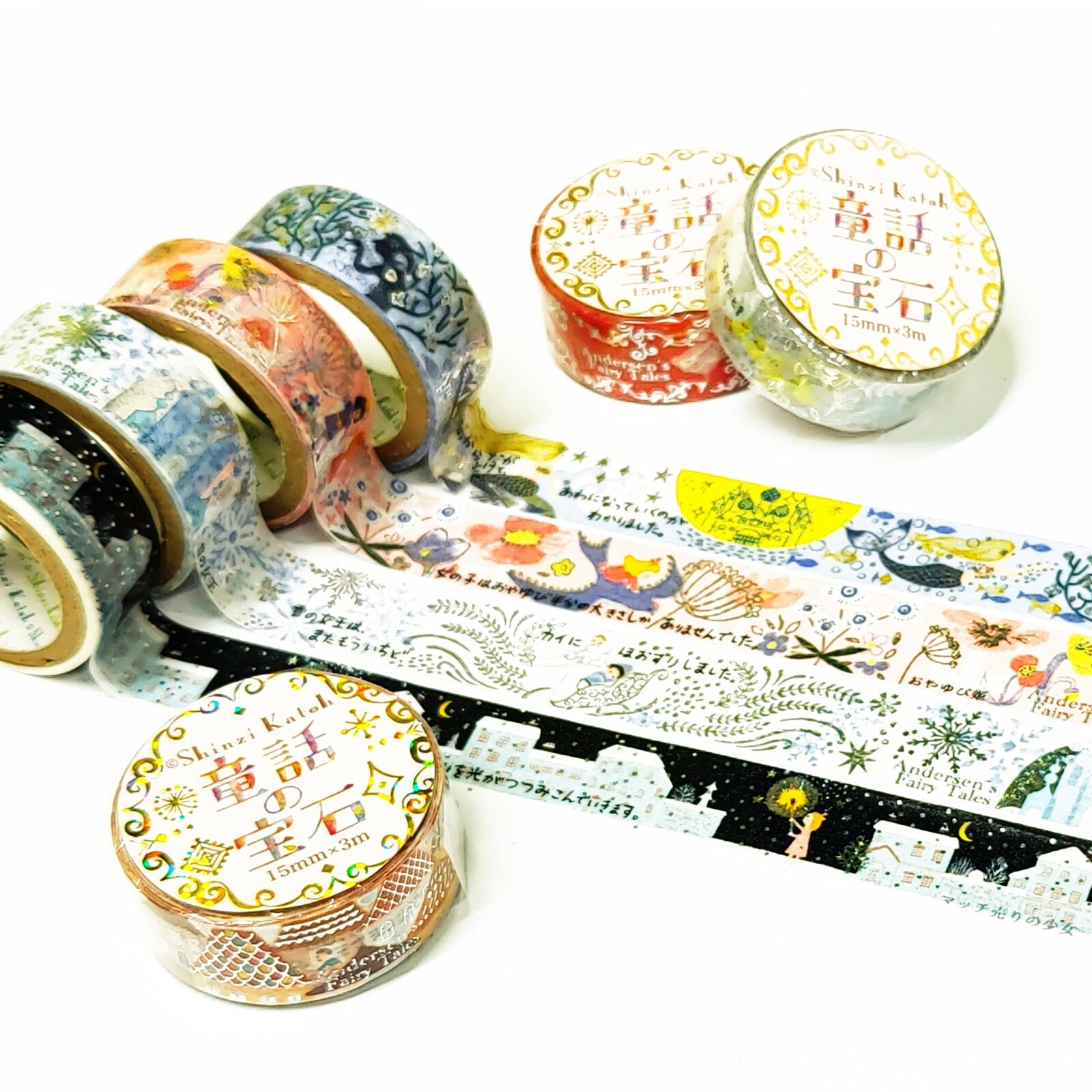 Decorative washi tape rolls with colorful designs on a white background, featuring illustrations by Shinzi Katoh.
