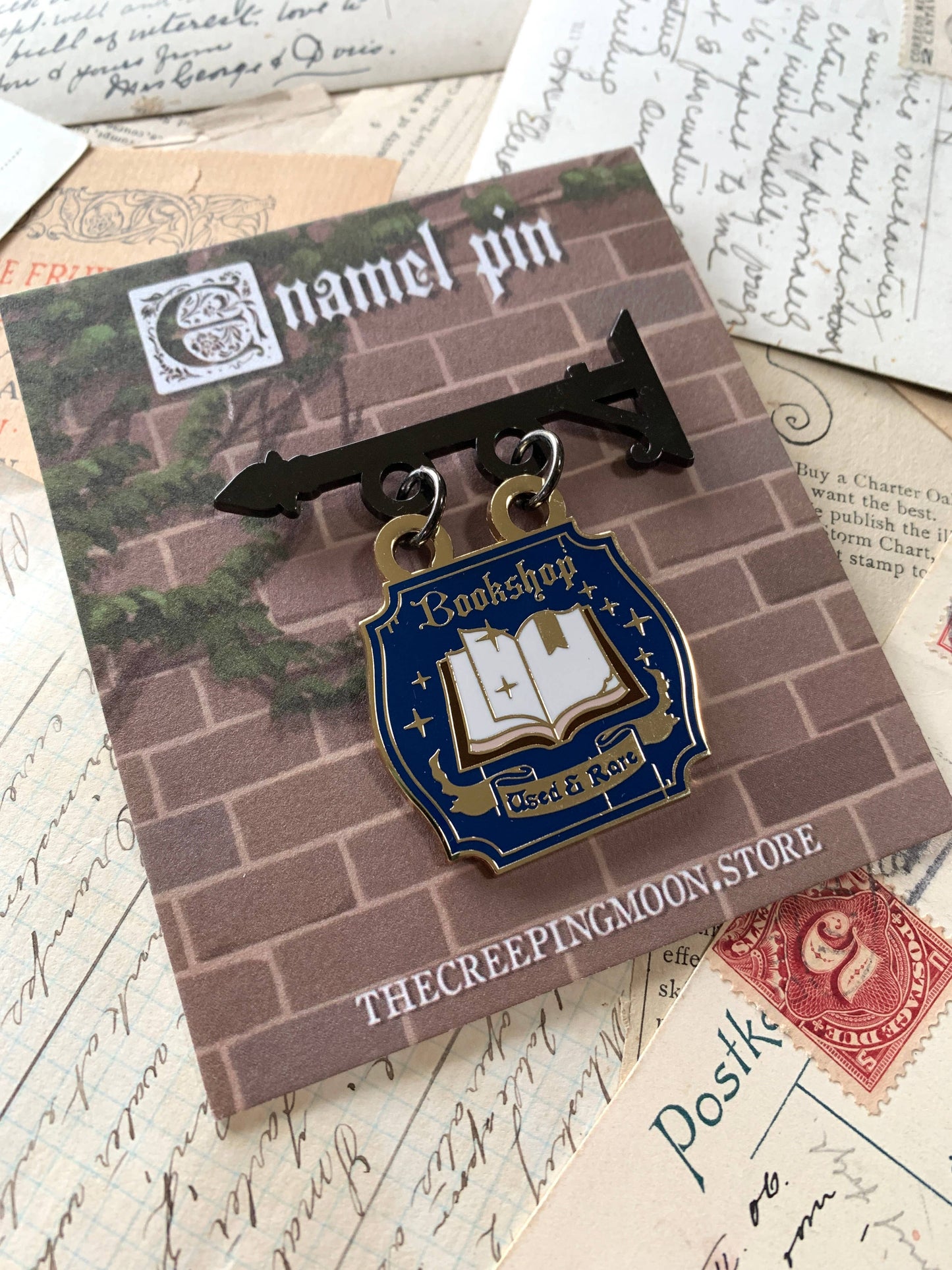 The Creeping Moon - Enamel Pin - Bookshop Sign