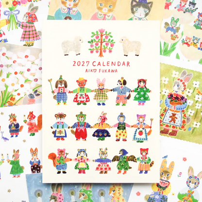 A 2027 calendar by Aiako Fukawa featuring whimsical illustrated characters in colorful outfits, displayed over a collage of matching artwork and character designs.