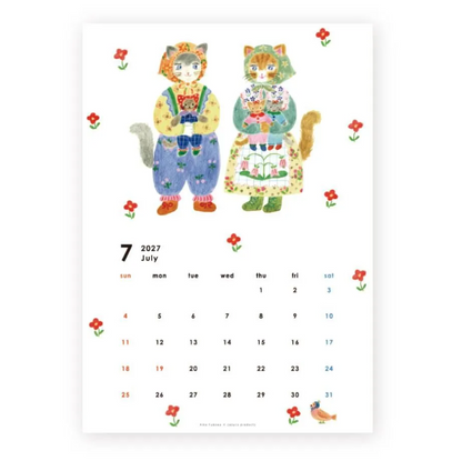 A vertical calendar page featuring a watercolor illustration of two cats in colorful folk-style clothing, surrounded by small red flowers, with a July 2027 calendar grid at the bottom.