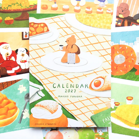 A colorful illustrated 2027 calendar spread by Mariko Furukda, featuring a teddy bear at a picnic table with plates, pastries, Santa Claus, and autumn-themed scenes.