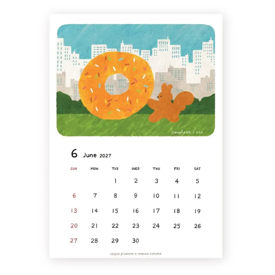 A single-page illustrated calendar page showing June 2027 dates below a colorful art panel with a large orange donut, a small brown squirrel, green grass, and a city skyline. The page is photographed on a plain white background.