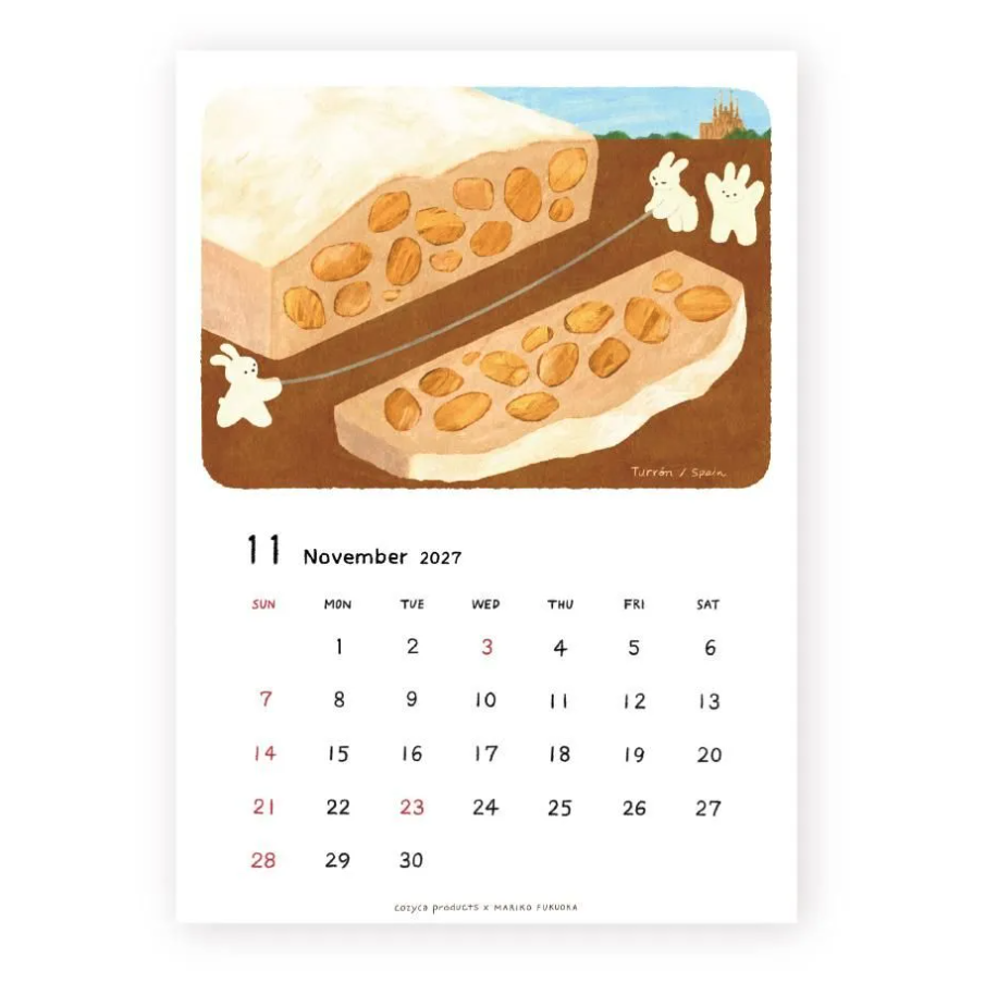 A single-page illustrated calendar on a white background, showing the date 11 November 2027 and the days of the week below a whimsical drawing of two white rabbits and a dessert loaded with almonds across a brown landscape.