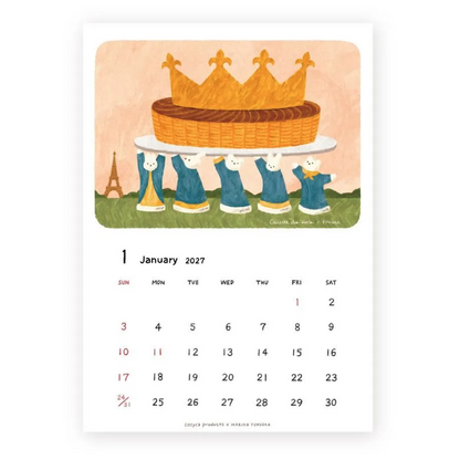A single-page illustrated calendar spread for January 2027, featuring a whimsical illustration of five rabbit figures carrying a large golden crown on a white table above a grassy landscape, with the Eiffel Tower in the background. The calendar page is centered on a light gray background.