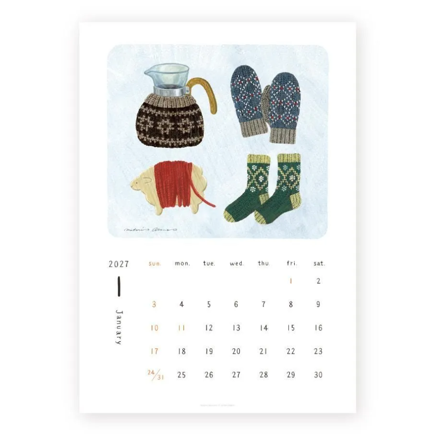 A minimalist monthly calendar print for January 2027, featuring an illustration of cozy winter knitted items—a patterned pitcher, mittens, socks, and a small rug—above a clean calendar grid on a white background.