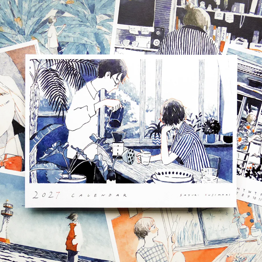 A 2027 calendar featuring an illustrated anime-style scene of two people in a cafe, displayed on top of a collage of other art prints and photos.