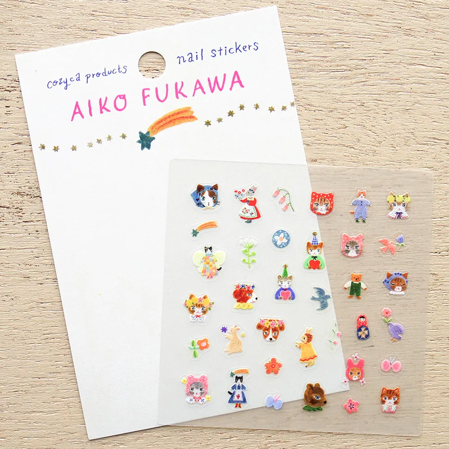 Nail stickers by Aiko Furawa on a wooden surface