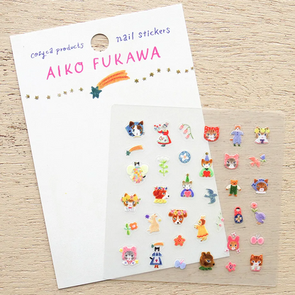 Nail stickers by Aiko Furawa on a wooden surface