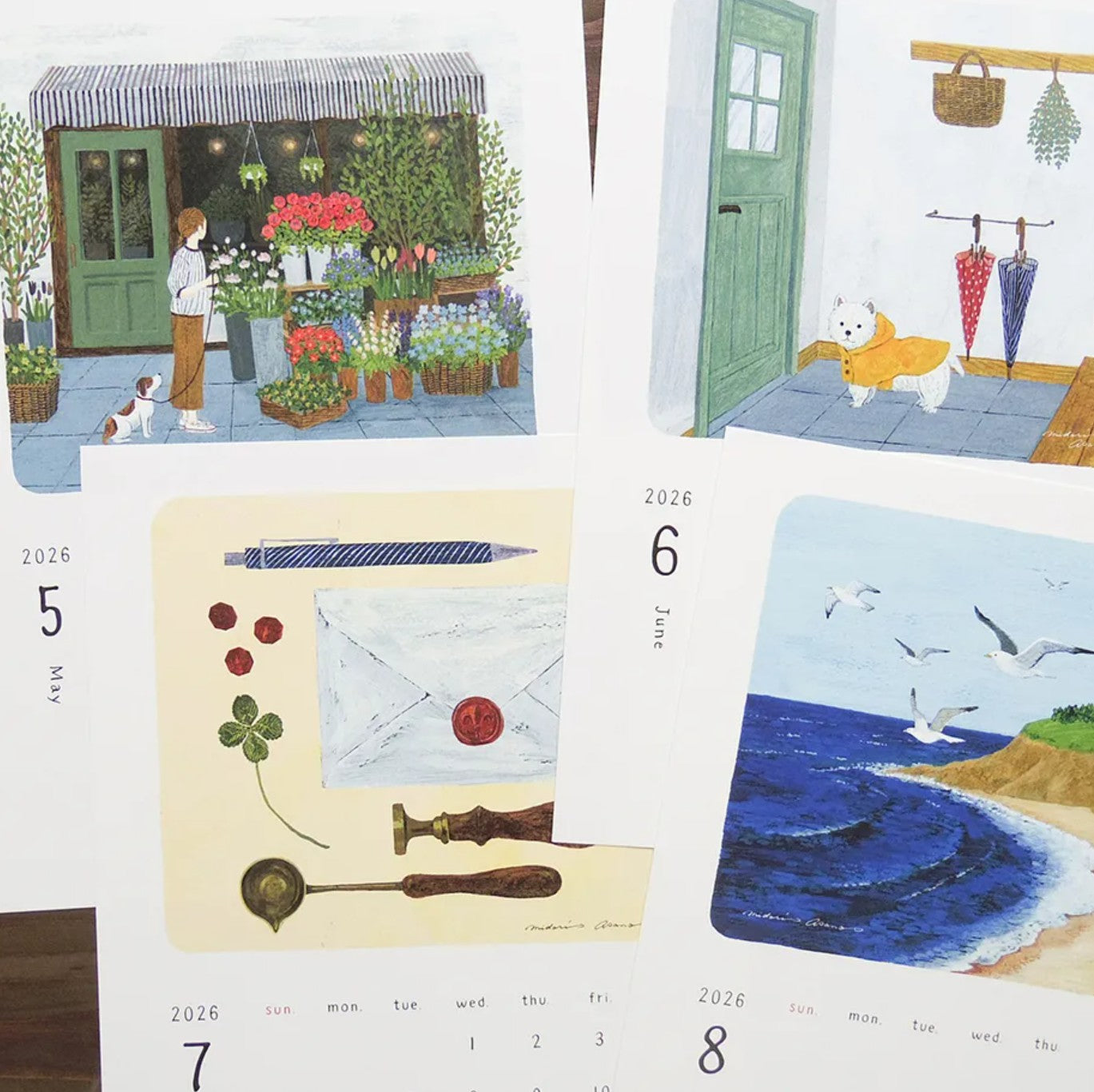 Four illustrated calendar pages showing different scenes and dates.