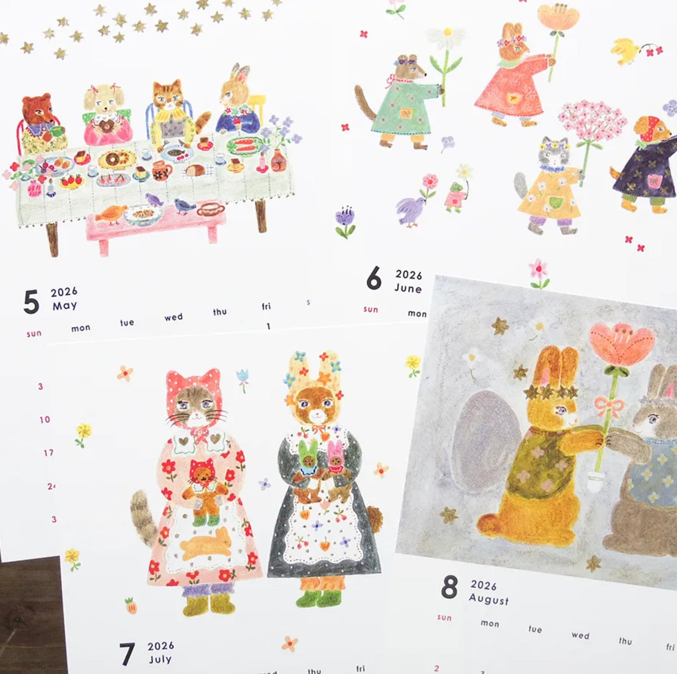 Calendar with illustrated animals and flowers on a white background