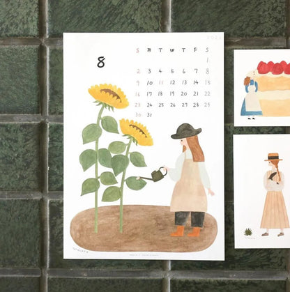 Calendar with illustration of a person watering sunflowers set against a tiled wall.